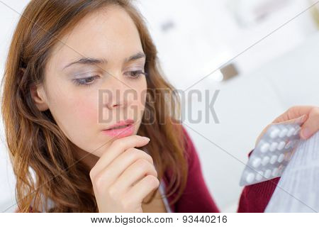 Worried woman holding pimms