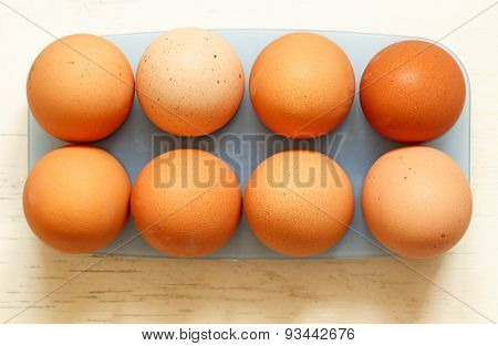 Fresh eggs close up on a white background