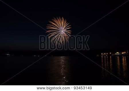 Colorful Fireworks With Reflection On Lake.
