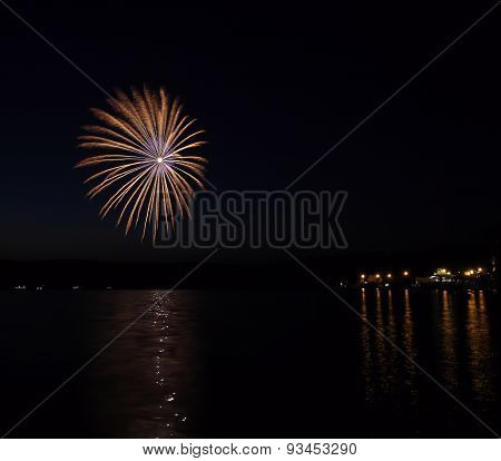 Colorful Fireworks With Reflection On Lake.