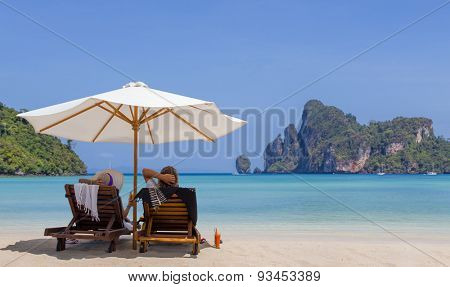 Mature couple relaxing on the beach in Thailand