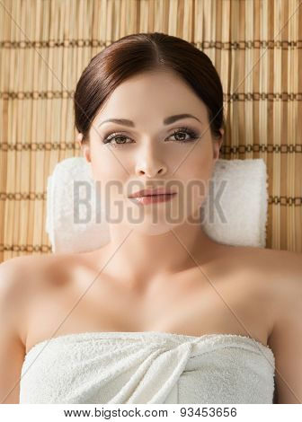 Young, beautiful and healthy woman in spa salon. Traditional oriental massage therapy and beauty treatments. 