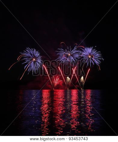 Colorful Fireworks With Reflection On Lake.