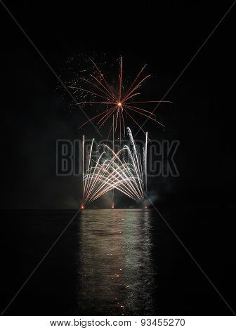 Colorful Fireworks With Reflection On Lake.