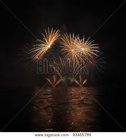 Colorful Fireworks With Reflection On Lake.