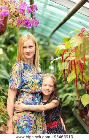 young mother with daughter in park