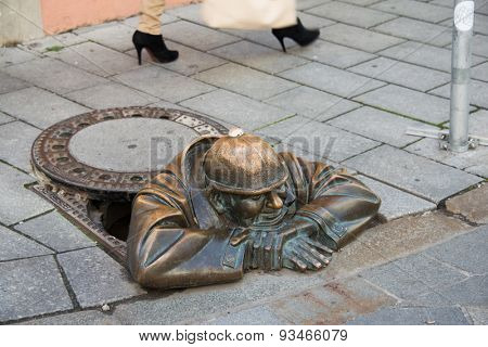 BRATISLAVA - OCTOBER 14, 2013: Cumil the sewage worker on October 14 in BRATISLAVA, Slovakia. Cumil is popular monument in Bratislava.
