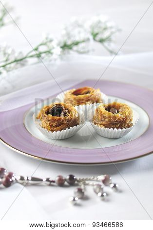 Baklawa and islamic rosary. An elegant and modern set up.
