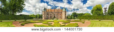 Kvaerndrup, Denmark - August 11, 2016: Panorama Of Egeskov Castle, located in the south of the island of Funen, Denmark. Vintage look.