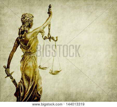 Statue of justice on old paper backgroundl, law concept