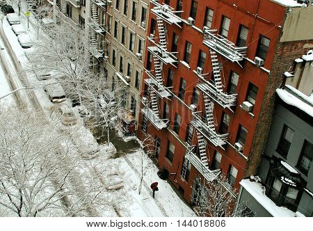 New York City - March 1 2005: View of West 82nd Street apartment buildings with their snow-covered fire escapes following a big winter storm