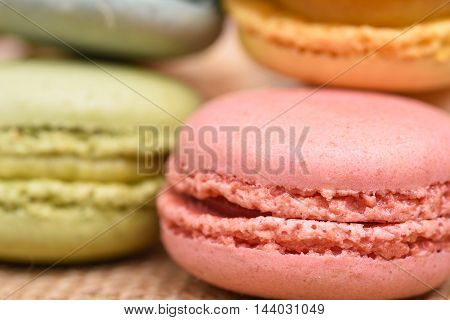Macro close up of pink macaron with selective focus