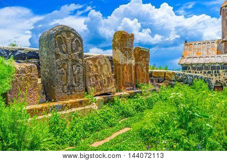 The preserved khachkars on the medieval cemetery between the churches of Sevanavank Monastery Sevan Armenia.