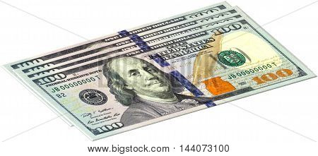 four one hundred dollars banknotes are stacked