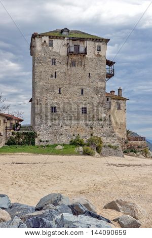Amazing view of Beach and Medieval tower in  Ouranopoli, Athos, Chalkidiki, Central Macedonia, Greece