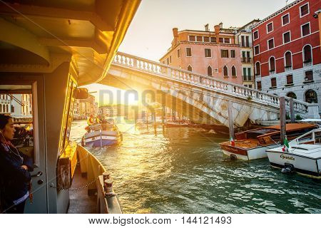 Venice, Italy - May 18, 2016: View from the Vaporetto on the way on Gand canal in the morning. Vaporetto is popular water taxi among tourists and residents in Venice