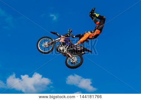 August 6 2016. Ryazan Russia. A professional rider at the FMX (Freestyle Motocross) make an acrobatic jump at the motorshow. Documentary Editorial Image.