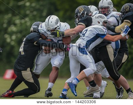 MOEDLING, AUSTRIA - MAY 24, 2015: RB Christian Bobo (#28 Devils) runs with the ball in a game of the Division I of the Austrian Football League.