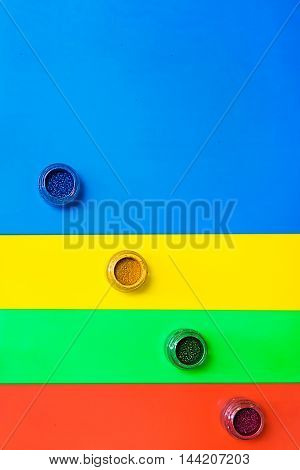 Various makeup products on the colotful background