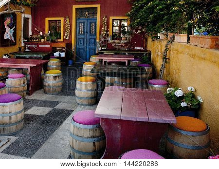 colorful cafe in Santorini - purple, yellow