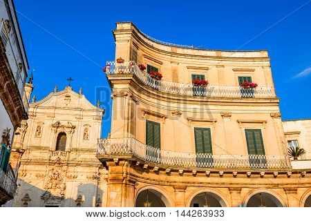 Martina Franca Puglia in Italy. Piazza Plebiscito and Basilica di San Martino landmark of Brindis region in Apulia Italia.
