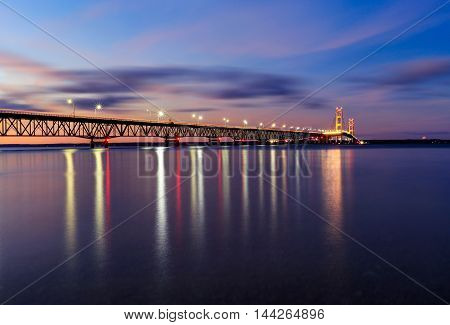 The Mackinac Bridge over the Straits of Mackinac at dusk connecting the upper and lower peninsulas of Michigan USA