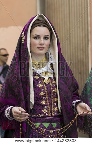 CAGLIARI, ITALY - May 1, 2014: 358 ^ Religious Procession of Sant'Efisio - Sardinia - portrait of a beautiful woman in traditional Sardinian costume