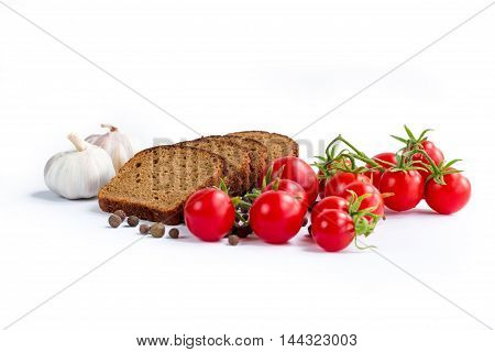 Composition of bread slices cherry tomatoes and garlic