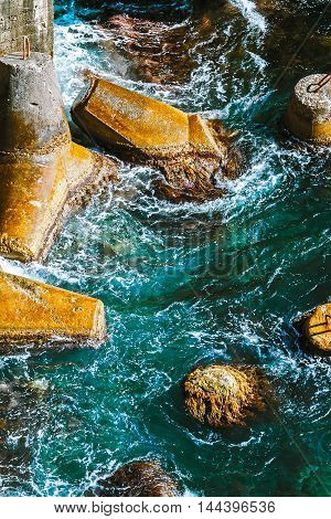 Turquoise Sea water and concrete Bui.blue wave.