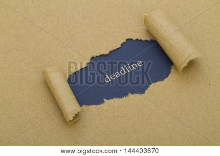 Deadline word written under torn paper .