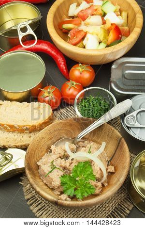 Crushed tuna canned. The fishing industry, canned fish. Diet food. Tinned tuna. Bowl with canned Tuna. Domestic food preparation.