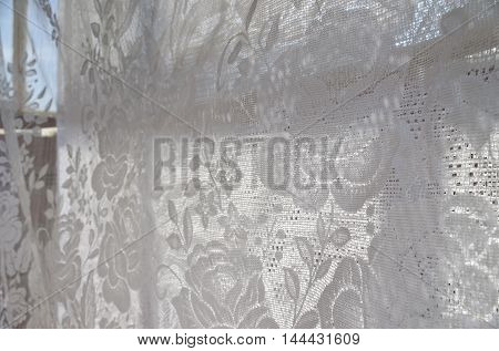 Through the tulle and curtains in the sunny day