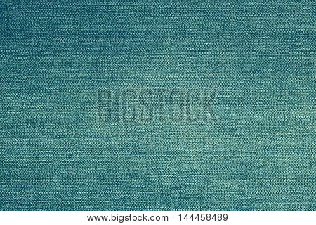 Light blue jeans or denim pattern for background.