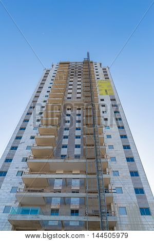 multistoried building on the background blue sky
