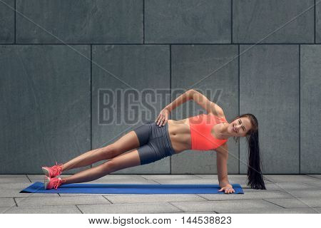 Fit Young Woman Doing Planks