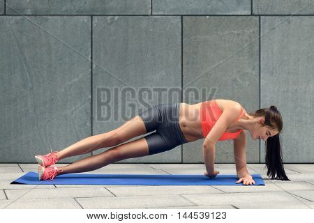 Fit Young Woman Doing Planks