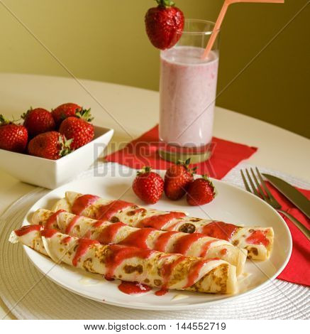 breakfast pancakes with strawberry jam and jogurt
