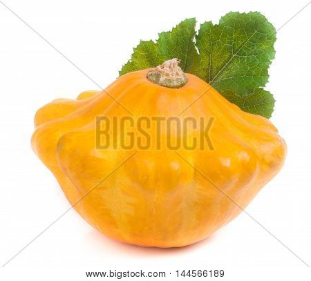one yellow pattypan squash with leaf isolated on white background.