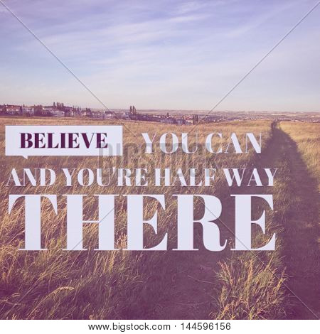 Inspirational text on field with path and blue sky and clouds background.   Lighting and instragram effects.