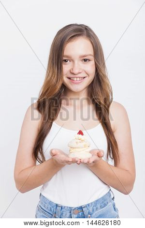Girl In Jeans Holding Cupcake