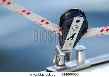 sheet of a sailing yacht; boat; sail trimming; rope; background