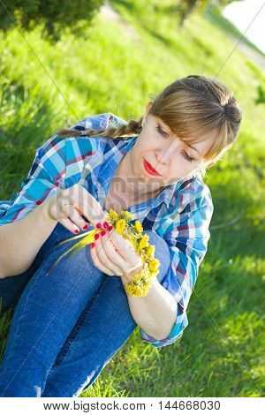 Portrait of a girl in a park on the grass