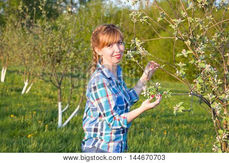 Portrait redhead beautiful girl in the spring