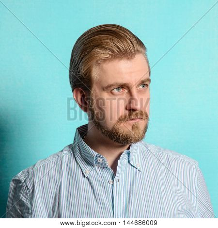 displeased rockabilly man vintage fifties style on blue background