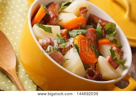 Irish Cuisine: Tasty Coddle With Pork Sausages, Bacon And Vegetables Macro. Horizontal