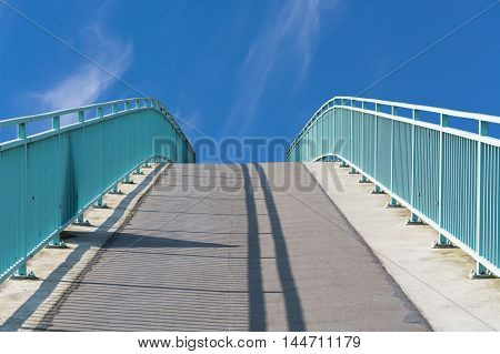 Pedestrian bridge steel arch structure over the river Ruhr in Muelheim Germany.