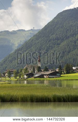 Sankt Ulrich Am Pillersee With Jakobskreuz On The Buchensteinwand Summit
