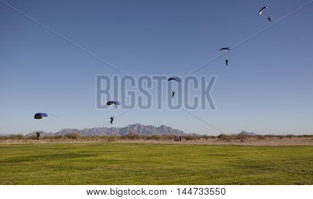 Compilation of Skydiver approaching for landing on daytime