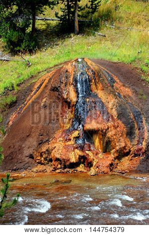 Chocolate Pot bubbles with internal heat along the Gibbon River in the Yellowstone National Park.