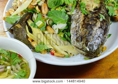 deep fried snake head fish with mixed herb dipping sweet sauce
